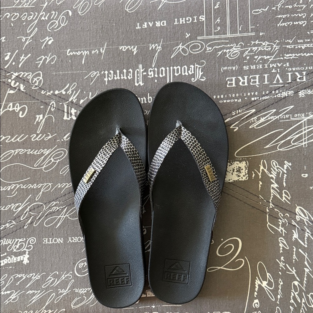 Reef Black Flip Flops with Silver Snake-Print Straps